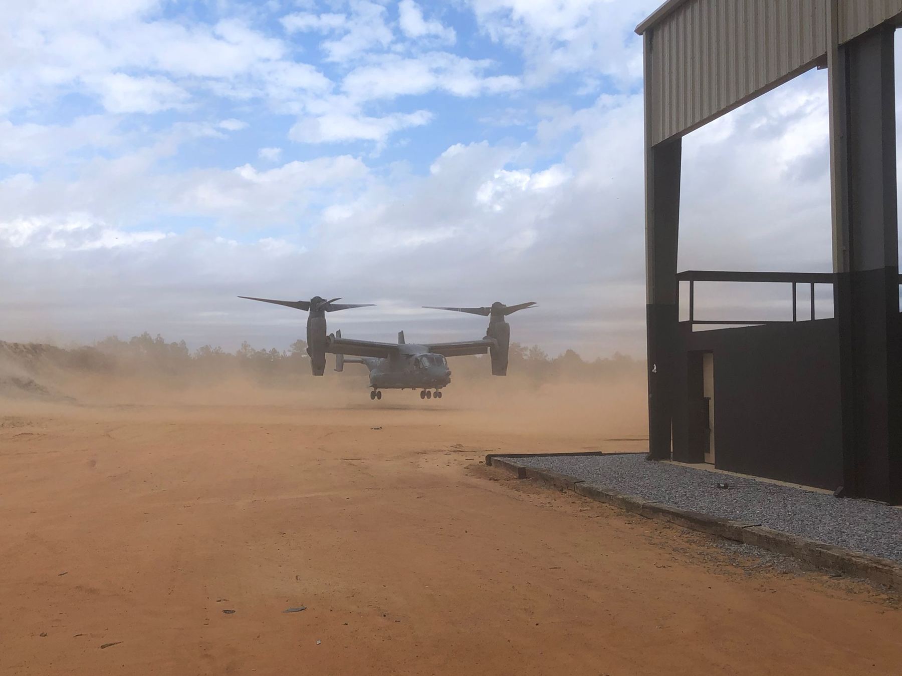 Tilt-rotor aircraft on the range beside the shoot house
